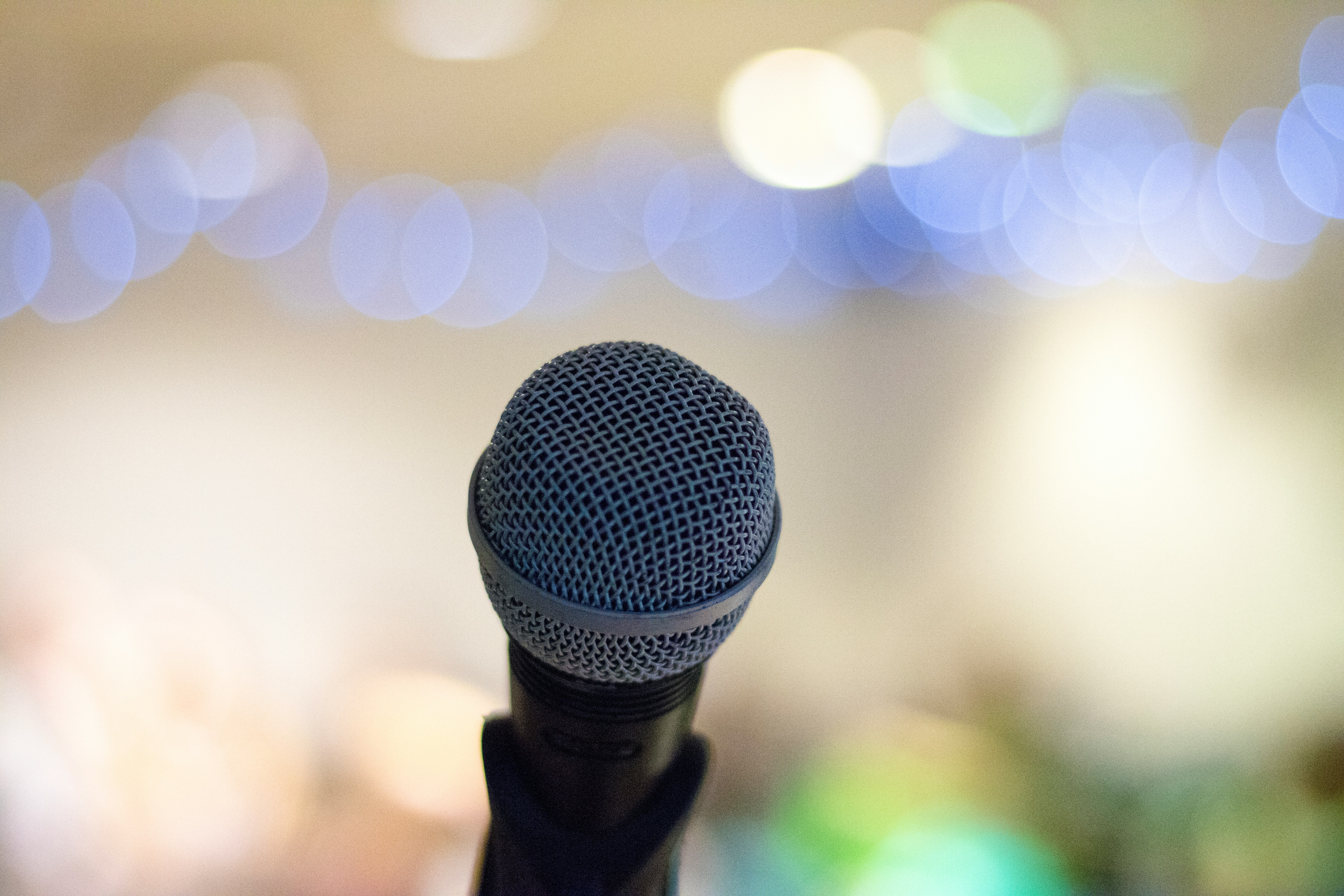 selective focus photography of microphone